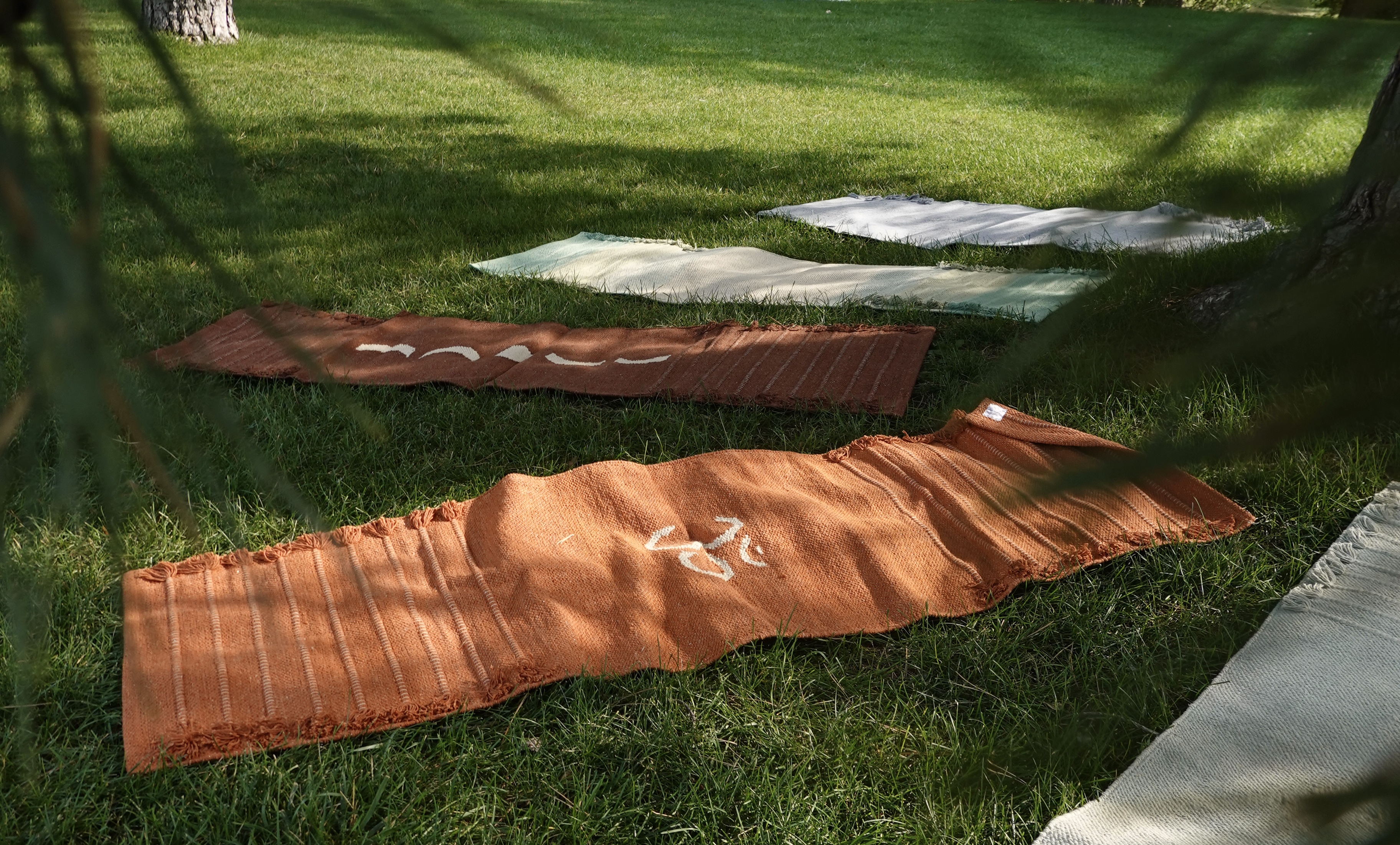 100% hand woven organic cotton yoga mats in Burnt Orange Om